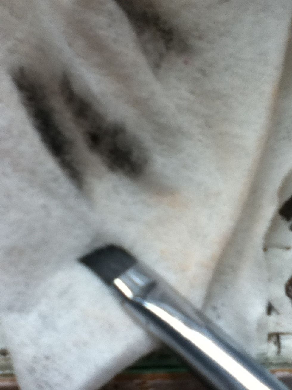 Dampen your angled eye brush, this helps to create a finer line.