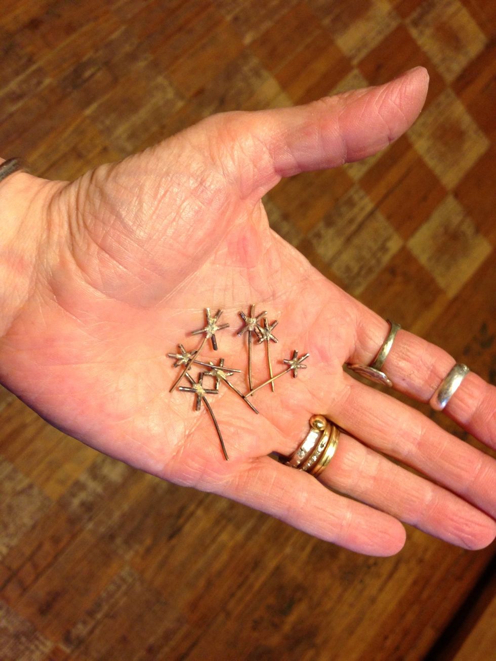 Dandelion seeds are an awful  lot like shooting stars. A pickling solution will clean the tarnishing that comes from heating, but it may not be necessary. If you like the oxidation look, simply wash.