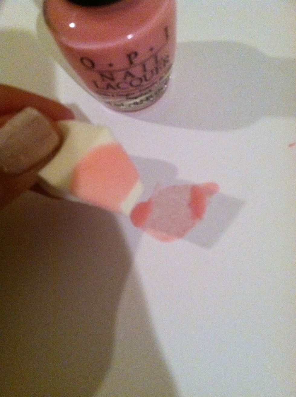 Dap the nail polish with the sponge