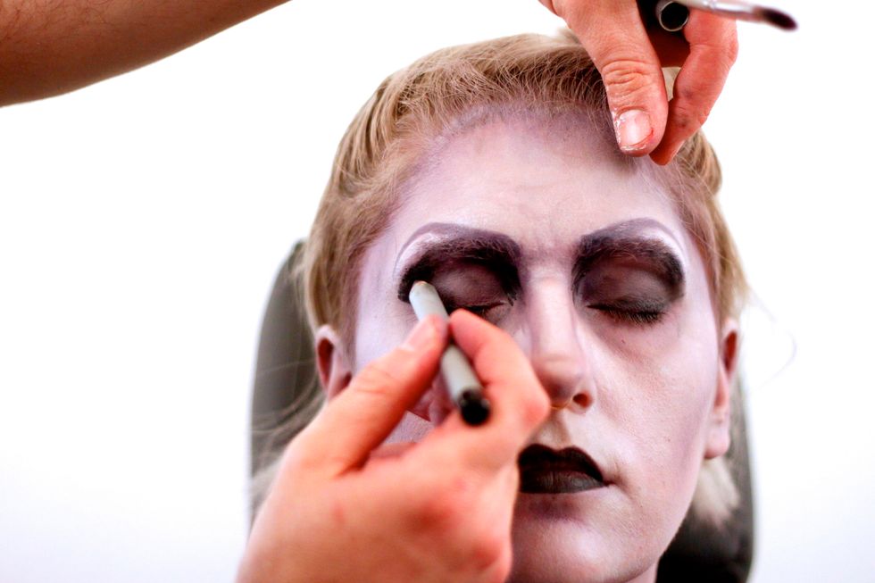 Darken the eye sockets.