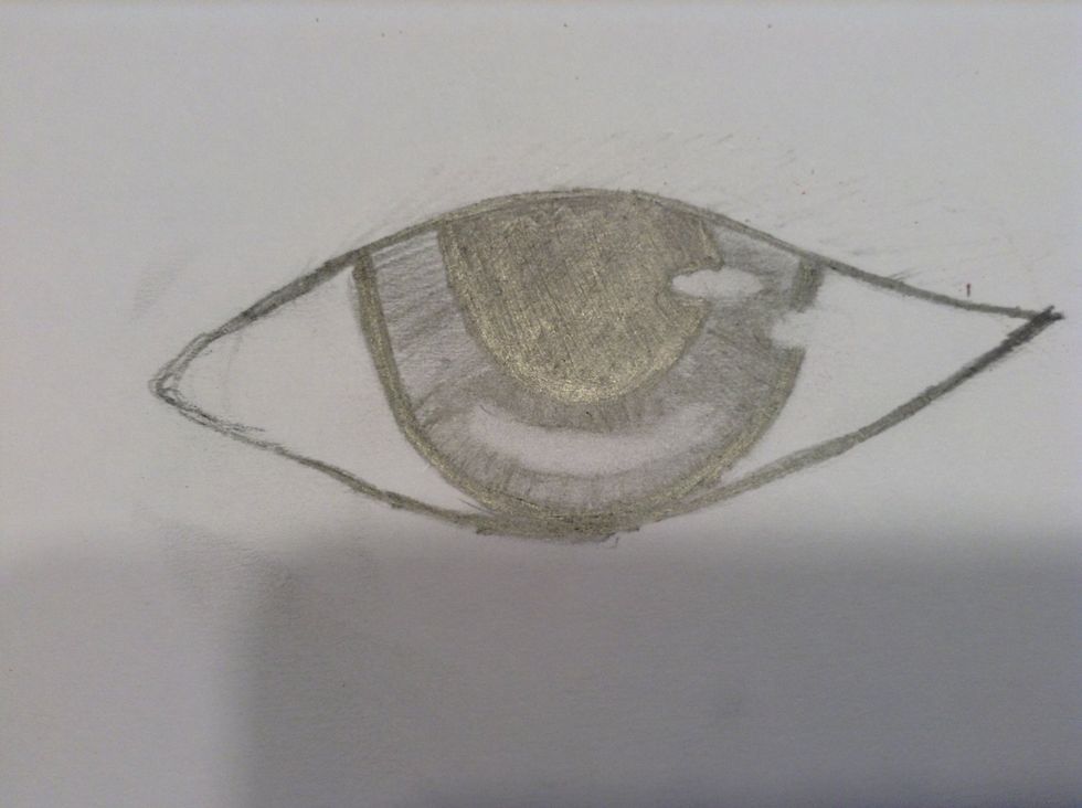 Darken the outside of the eye