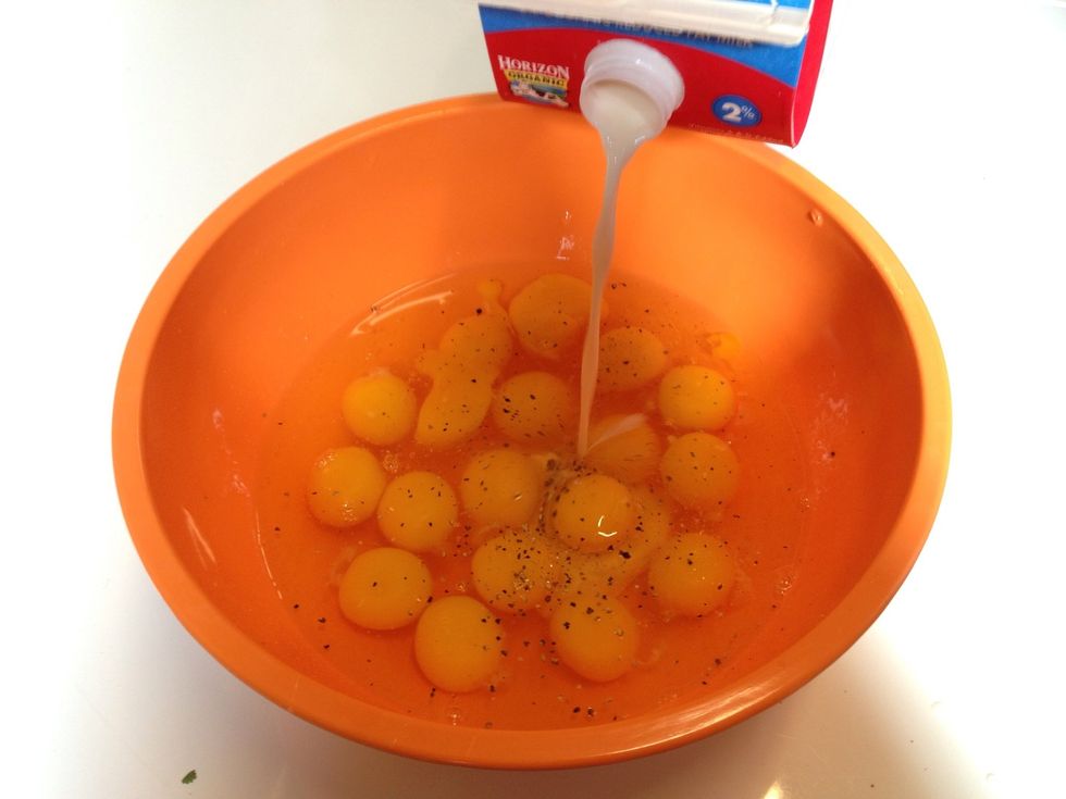 Dash of milk. Use less milk if you're serving less eggs. The milk will help reduce burning of the eggs and give the eggs a fluffier texture.