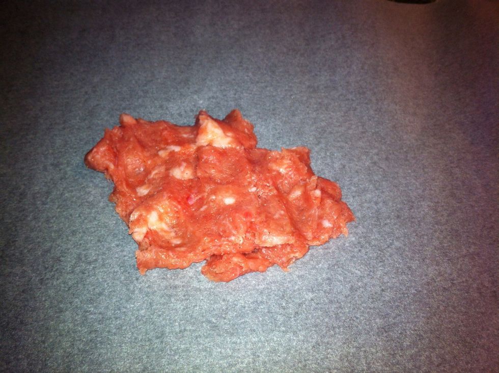 DAY 2. Preheat oven to 160 deg C. On a flat tray-line baking paper. Using your finger flatten the meat to about 0.5cm thickness. You can even place cling wrap over the meat & flatten using rolling pin