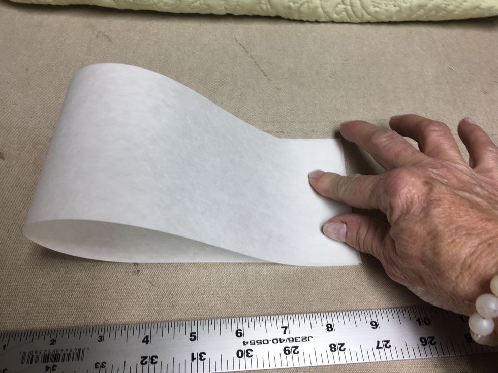 Decide the amount scallops you want on each side and fold the buckram into equal sections for the amount of scallops.