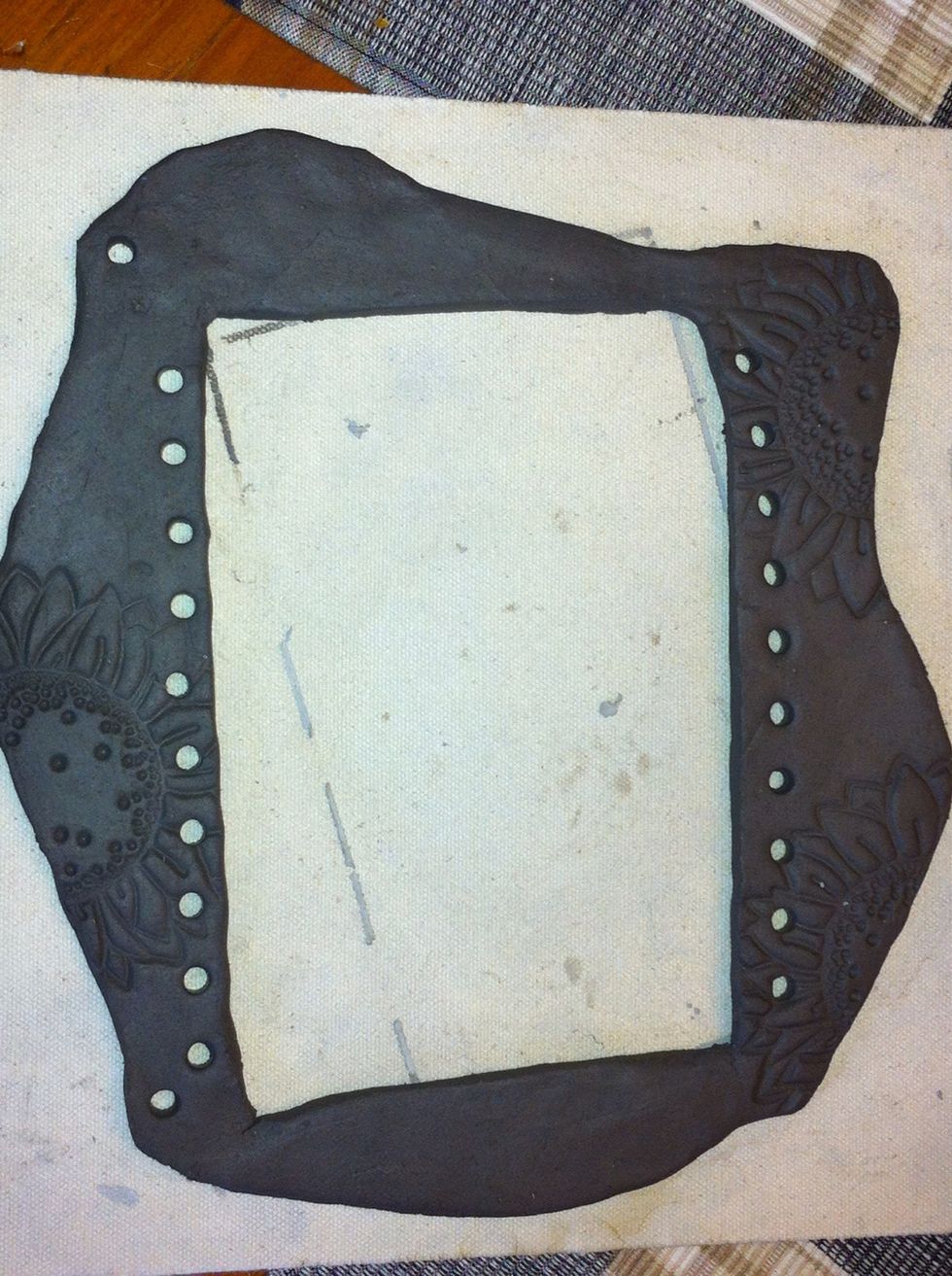 Decide where the top is. Make an extra hole on each side for hanging.