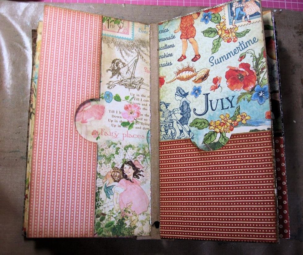 Decorate each page with monthly papers from 8x8 pad. To create the side pocket, cut paper to measure 5 5/8" wide x 7" tall. Score to fit chipboard page, glue top & bottom edge & add thumb hole.