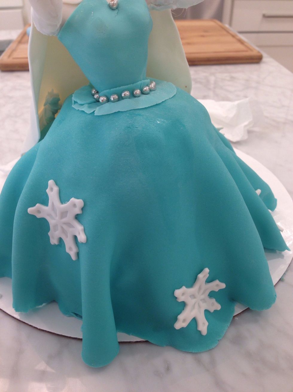 Decorate her gown