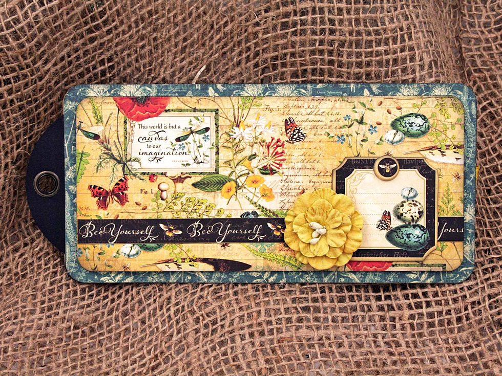 Decorate the outside flap with chipboard, a decorative strip and flowers.