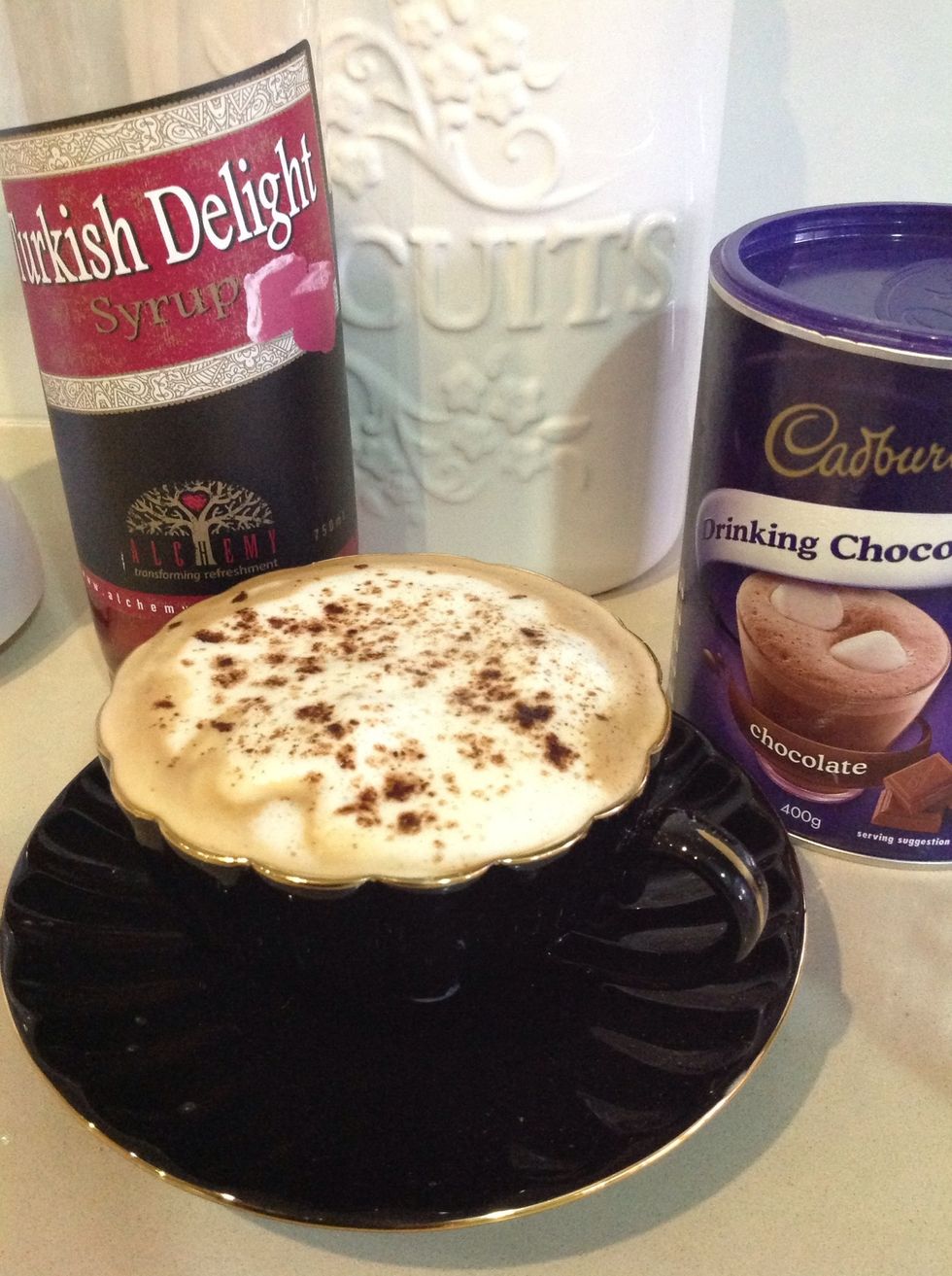 Decorate with chocolate powder and add sugar/syrup to sweeten.