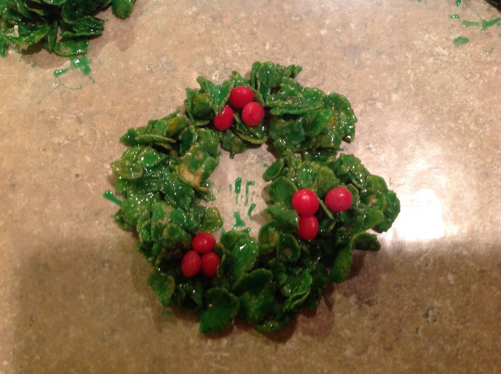 Decorate with red hot candies immediately.