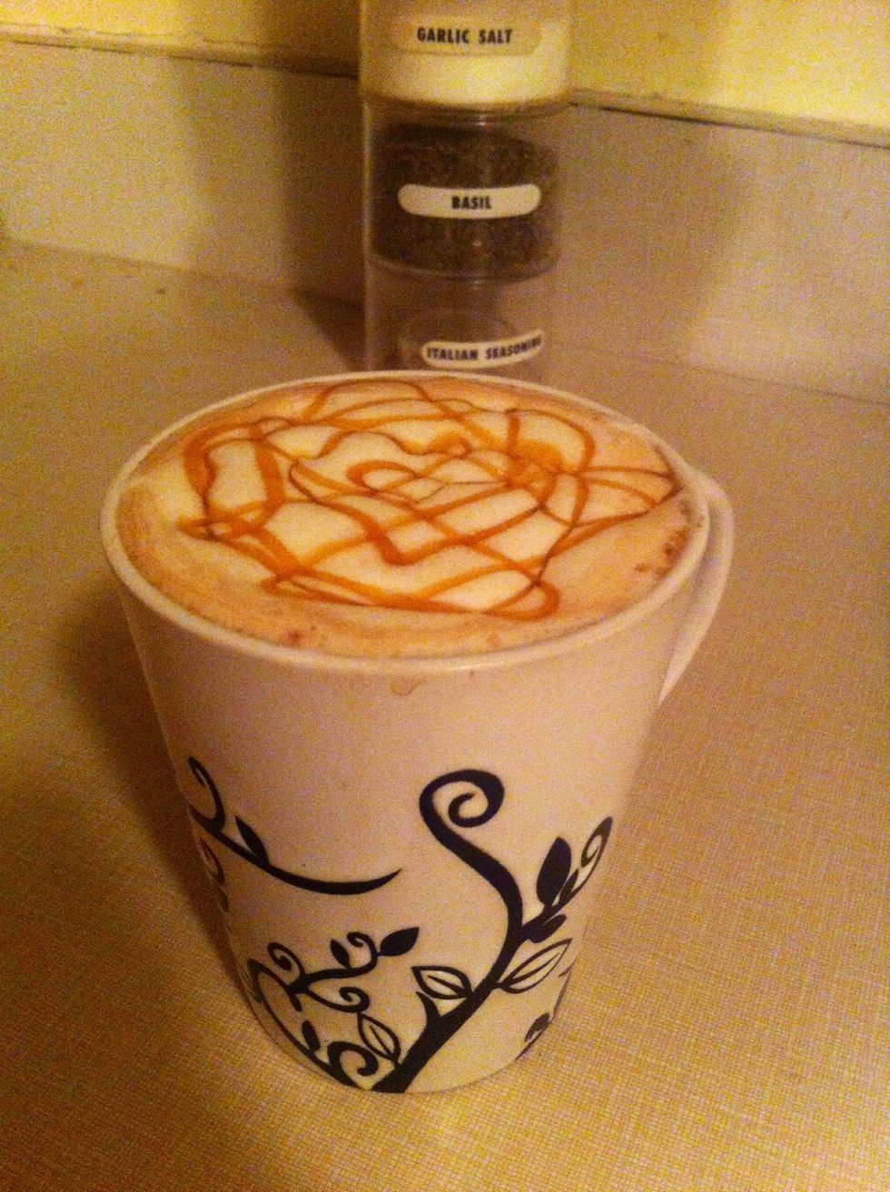 Decorating it! As you can see I'm no artist. But, drizzle a bit of caramel syrup on top to give it that much more appeal, and: Ta-da! I hope you enjoy it as much as I am \ud83d\ude0a Let me know what you think!