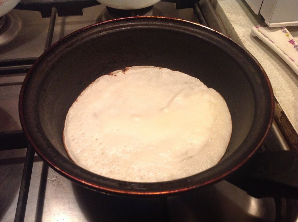 Decrease the heat to middle. Bake until there are no water drops on top (approx 30 second), then roll over