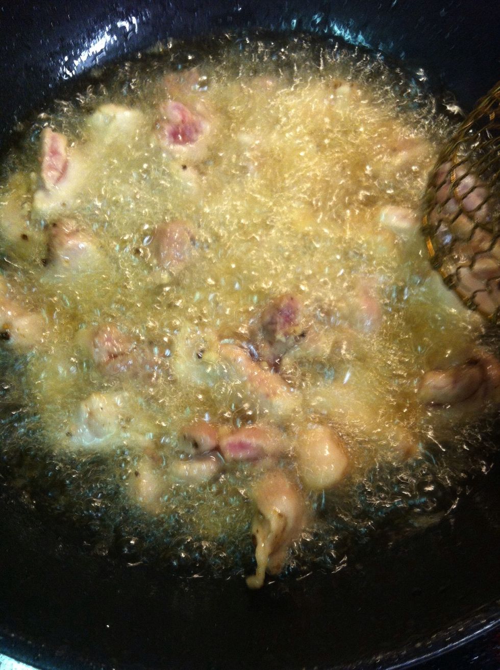 Deep fried chicken with high heat in the wok