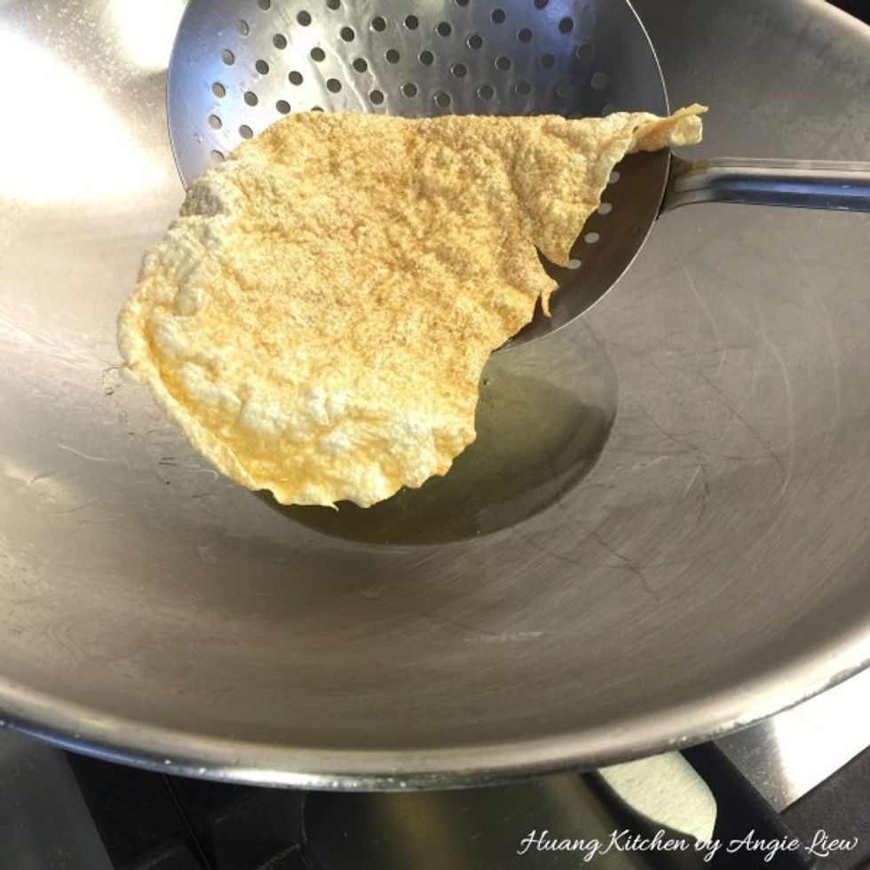 Deep fry the dried beancurd skin, piece by piece, till just golden brown. Each piece takes less than a minute.