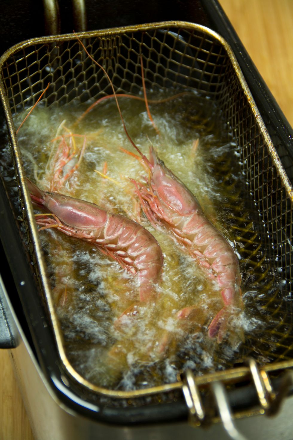 Deep fry until golden and the shrimp test done. Do not overcook or the shrimp will be tough.