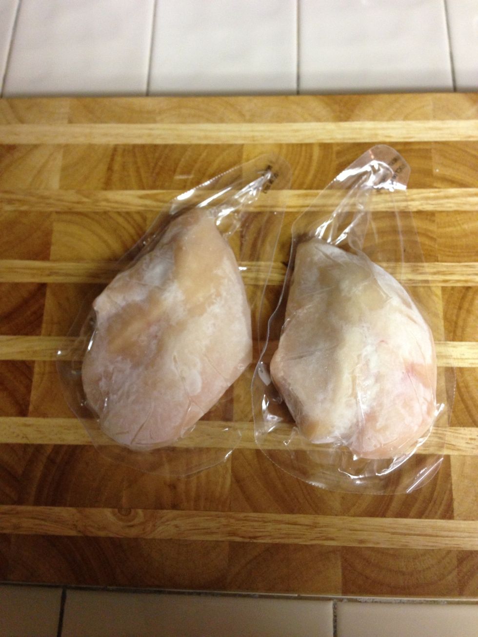 Defrost boneless, skinless chicken breasts