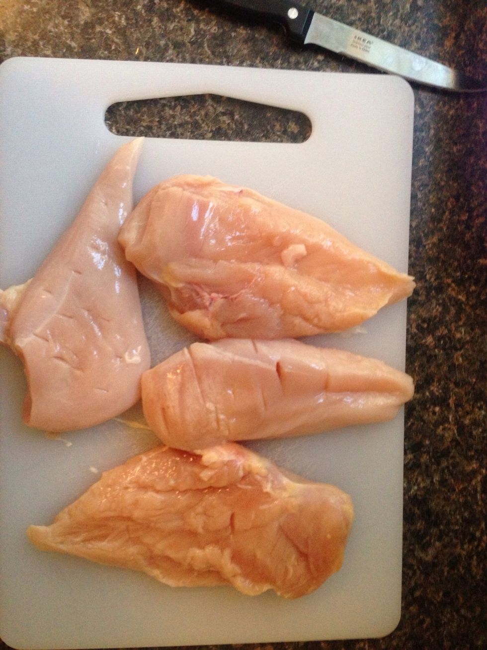 Defrost however many chicken breasts you want. Chop up into cubes (or as cubey as you can get) 4 made about 35 bites, they're a heavy dish so about 6 or 7 is enough for a Thai salad or to sit on rice.