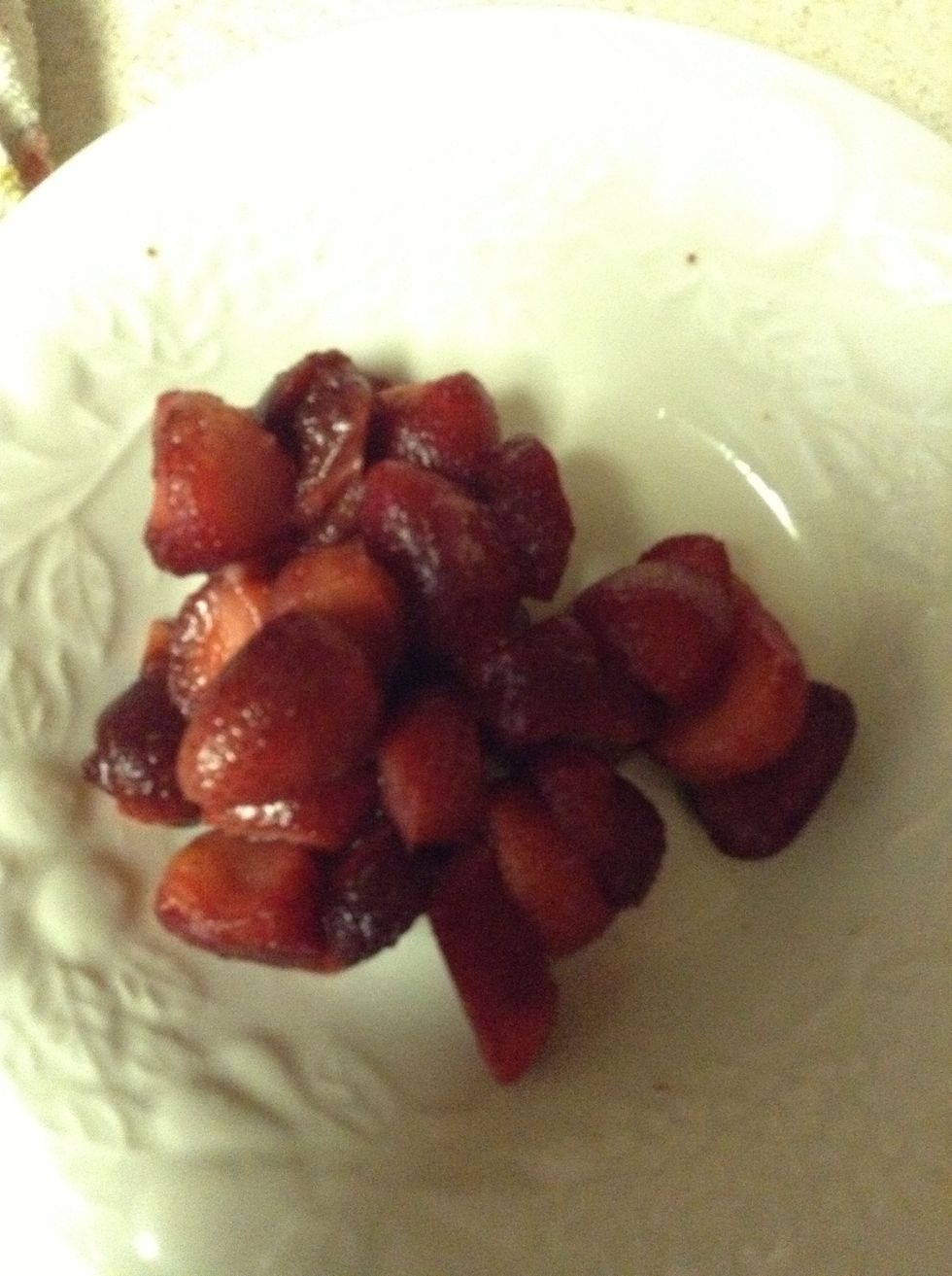 Defrost strawberries if frozen. Simply run cold water over the berries.