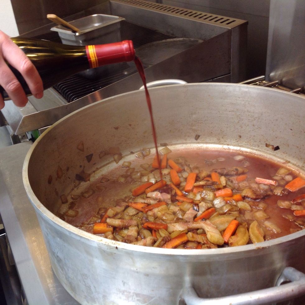 Deglaze. Add stock and short ribs. Bring to a boil