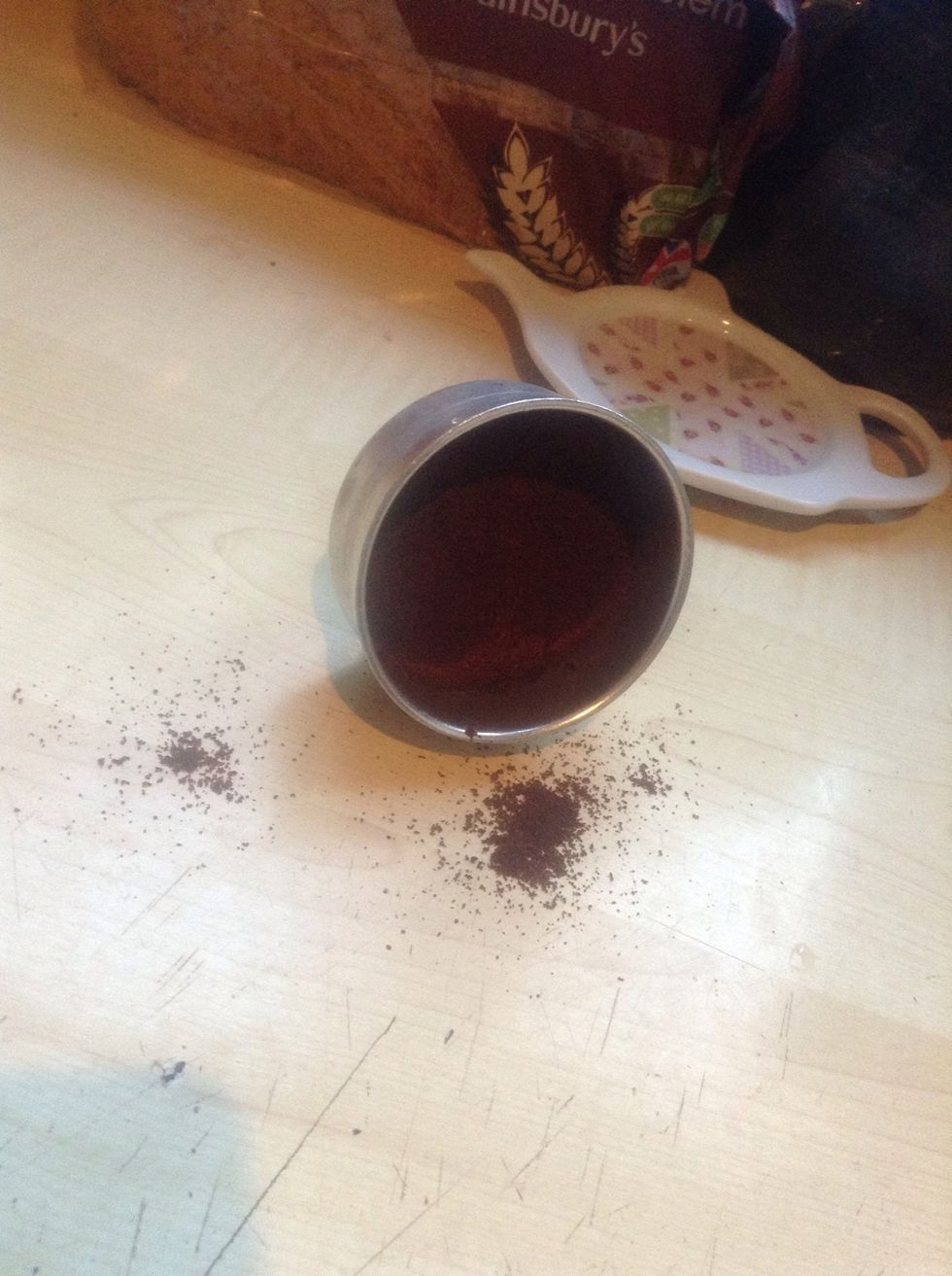 Depending on how many cups and the strength of the final product add your ground coffee,for one cup, I usually fill it about 1/4 full. If you are unsure, experiment with it.
