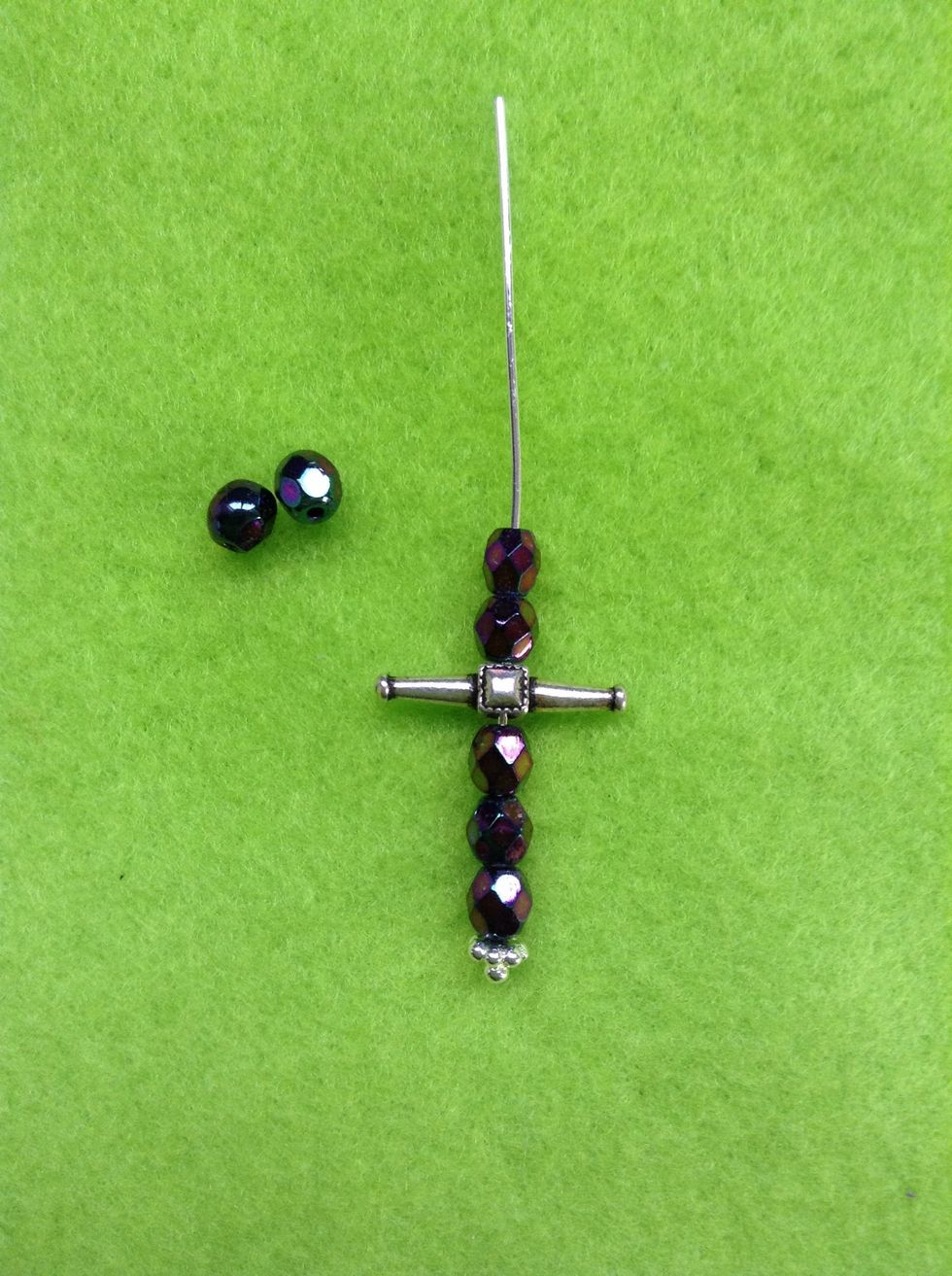 Depending on size of bead, assemble more beads on the bottom than top.