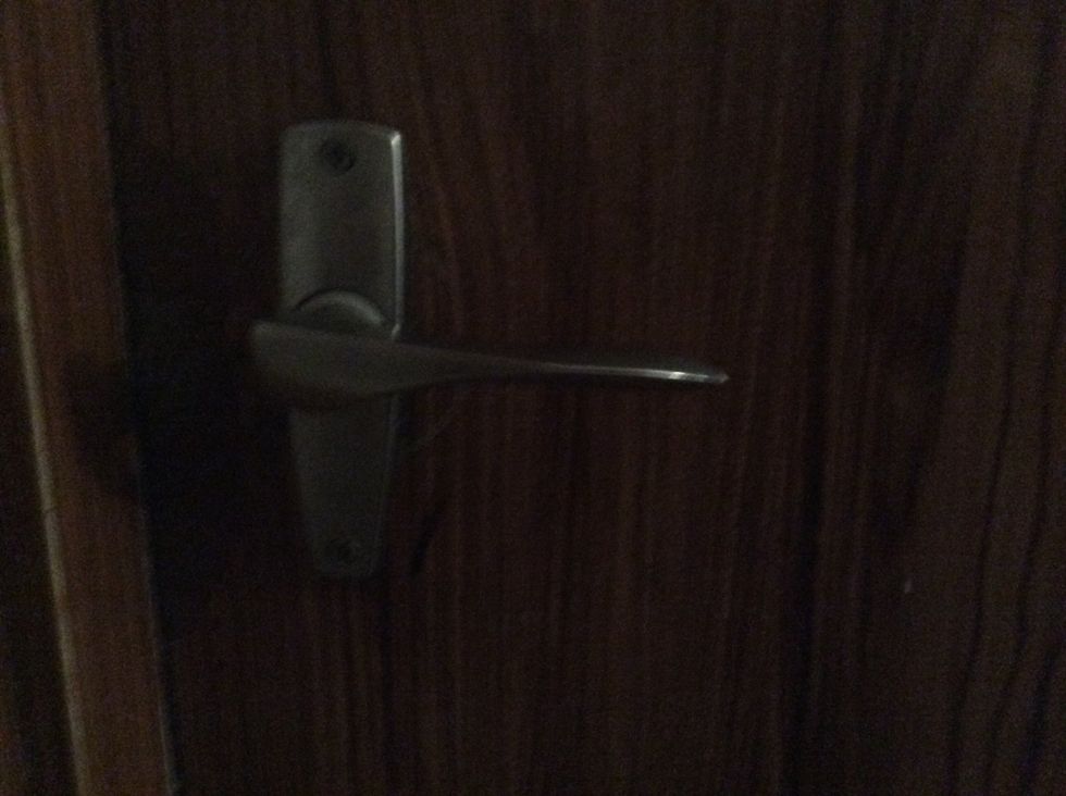 Depending on what kind of handle you have you will either pull down on the handle or twist it. On this handle pull down