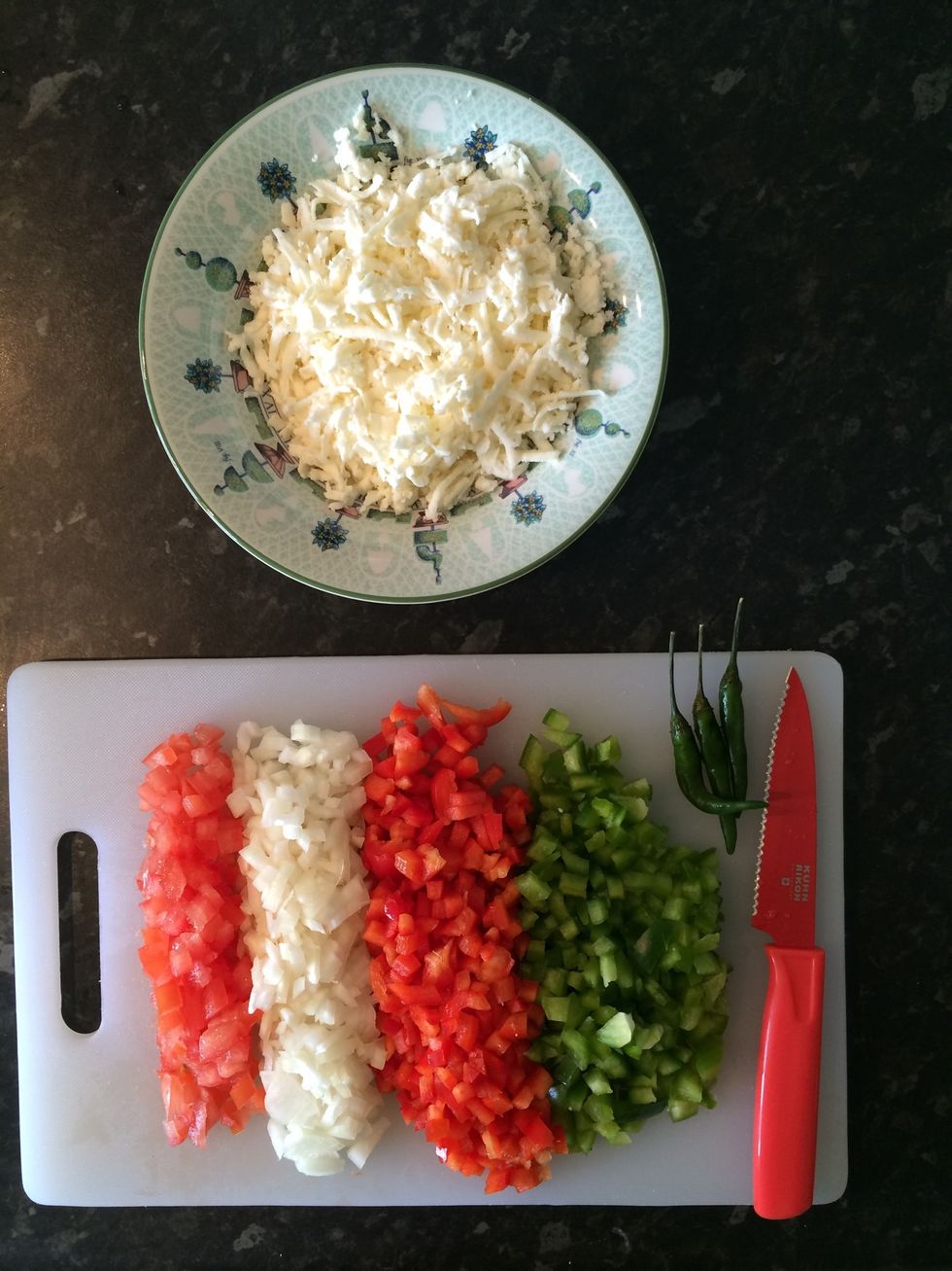 Deseed the tomato and capsicums and dice finely with the onion and chillies
