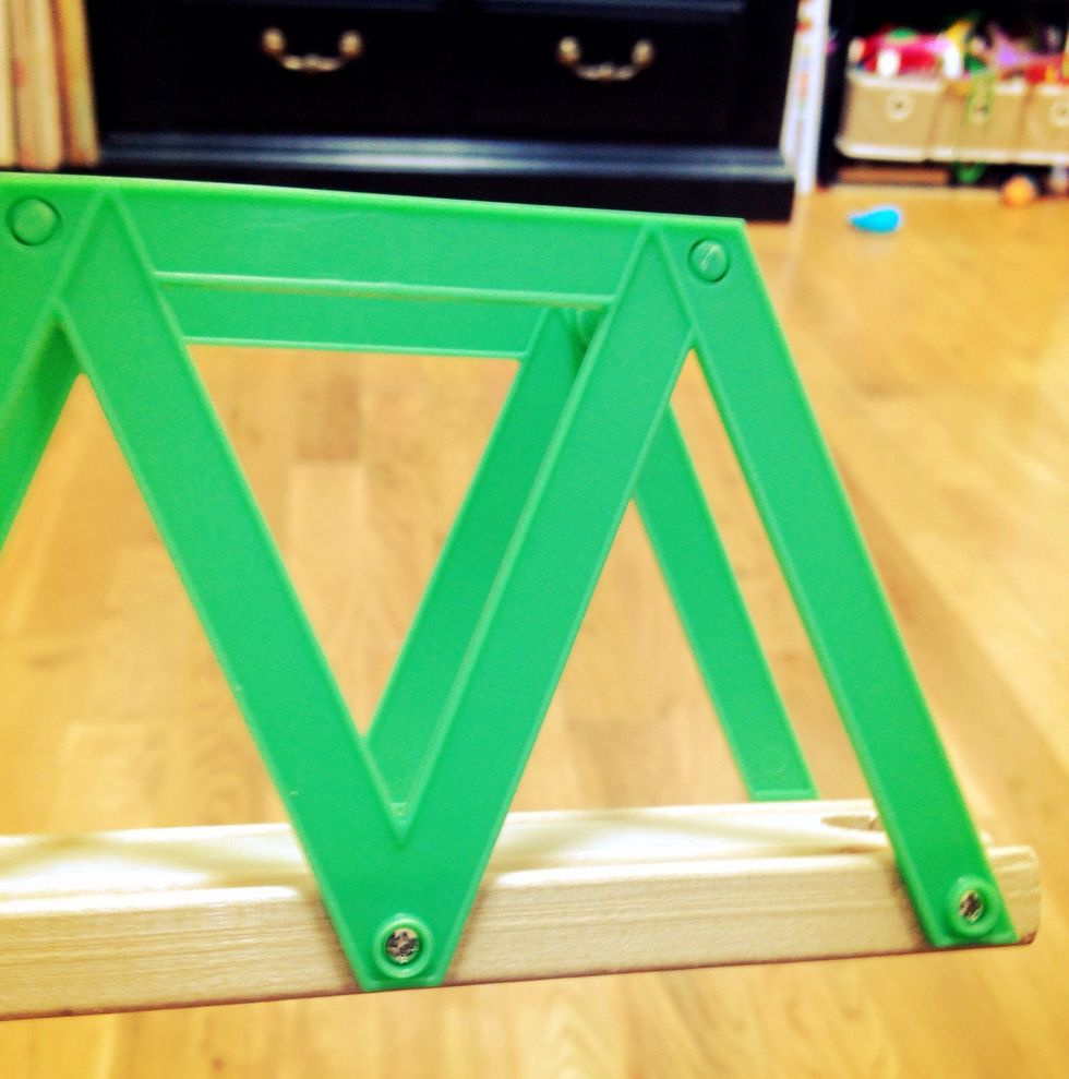 Determine the type of screw driver you will need to remove the sides of the train track piece. Note how large the washers you will be using should be.