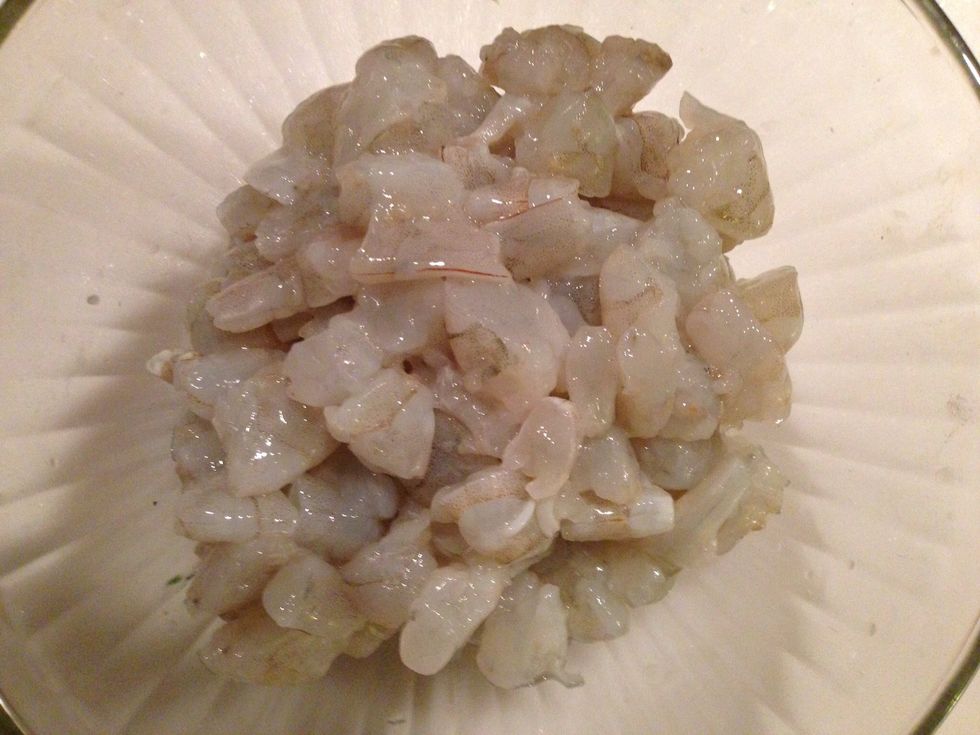 Devein and rinse shrimp in white vinegar then cut each shrimp into four equal parts.