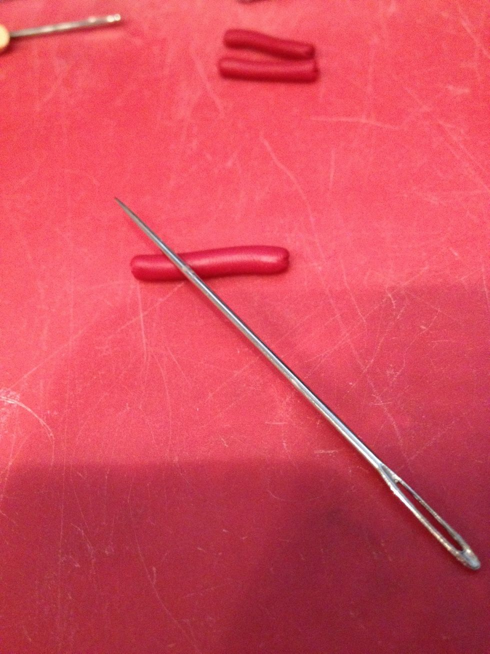 Diagonally press a large needle on the top of the hot dog to make lines