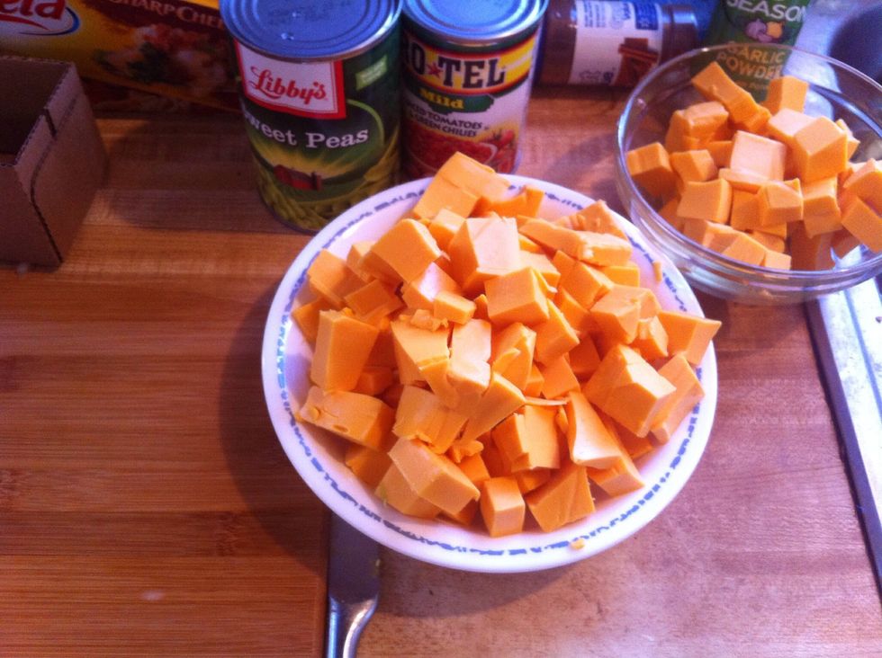 Dice 2lbs. velveeta.  I use sharp velveeta