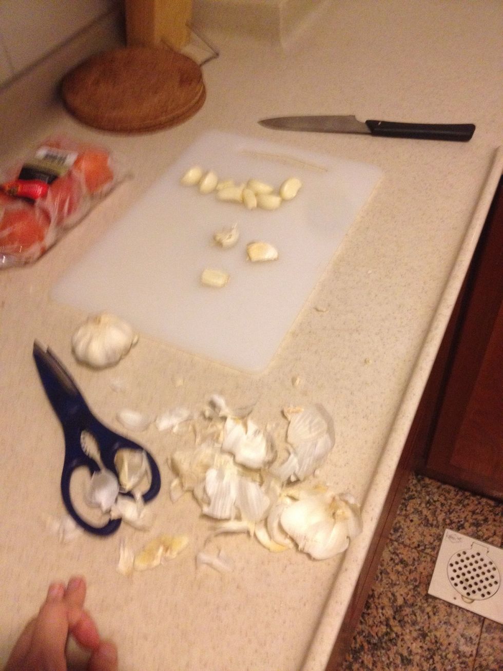 Dice a clove of garlic.