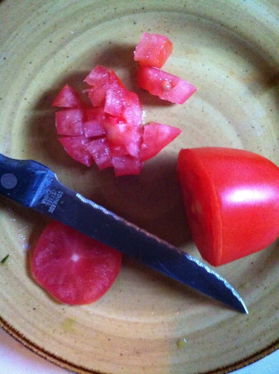 Dice a small tomato to use after other veggies are cooked