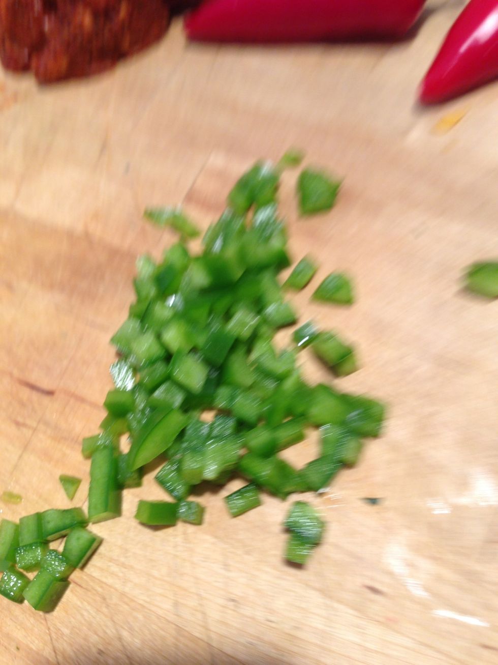 Dice green bell peppers