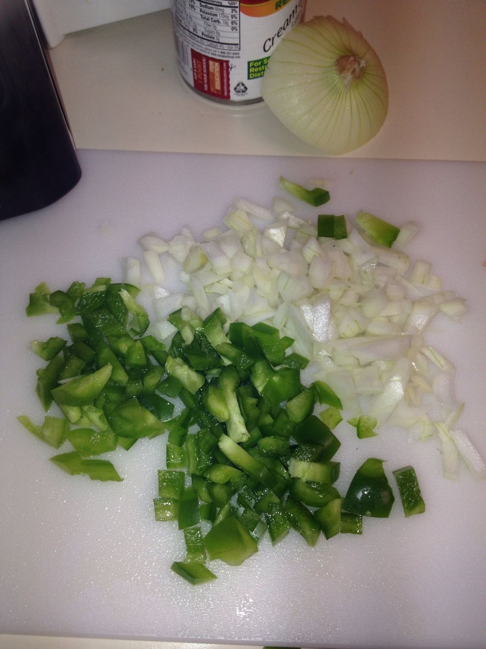 Dice green peppers and onions