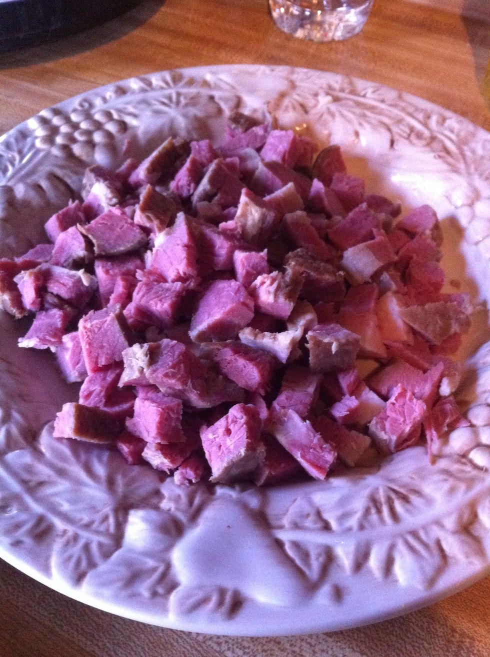 Dice precooked corned beef into bite size pieces