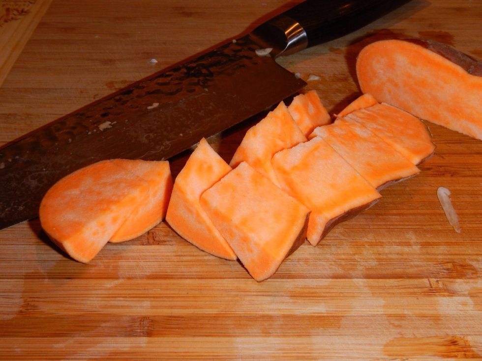 Dice sweet potatoes and apples into uniform pieces.