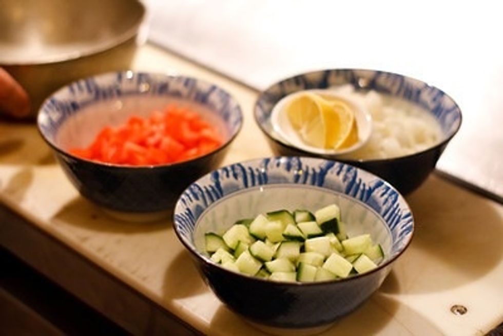 Dice the cucumber, tomato and onion in 1/2 inch pieces. Have approx equal amounts of each or whatever you prefer.