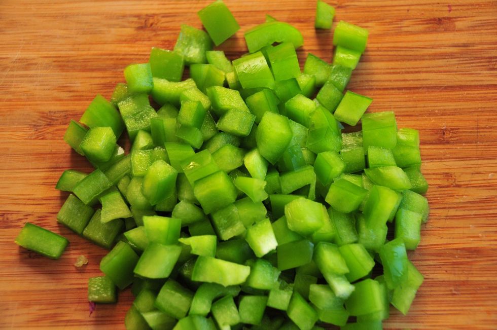 Dice the green bell pepper into small little pieces.  Place in bowl with onion and tomatoes.