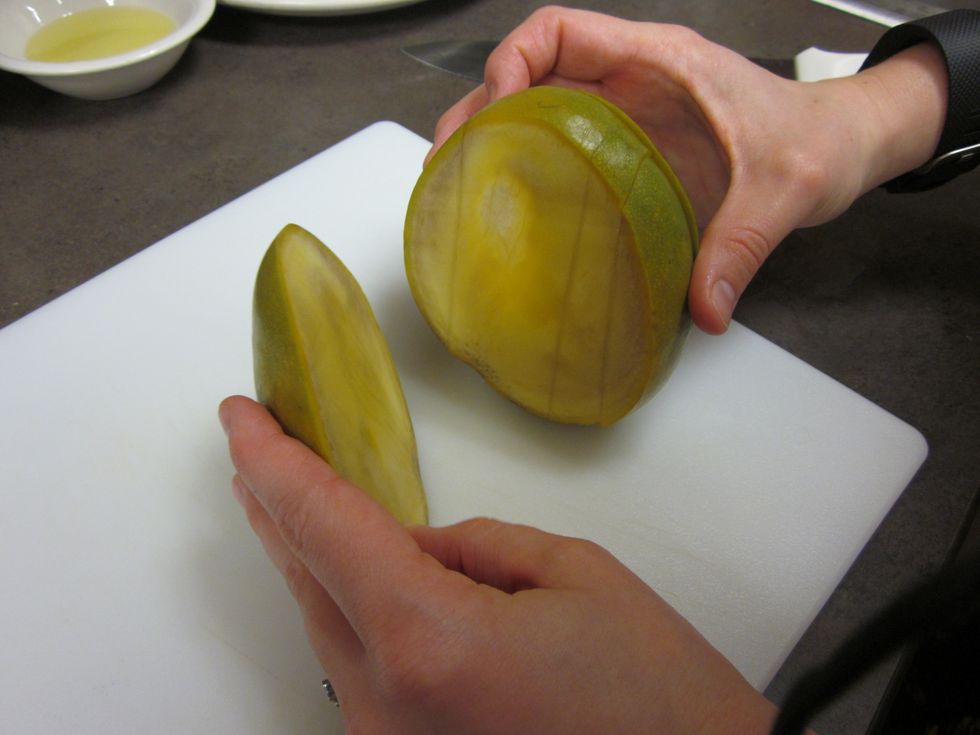 dice the mango it is easiest to cut the mango down the side like in the photo