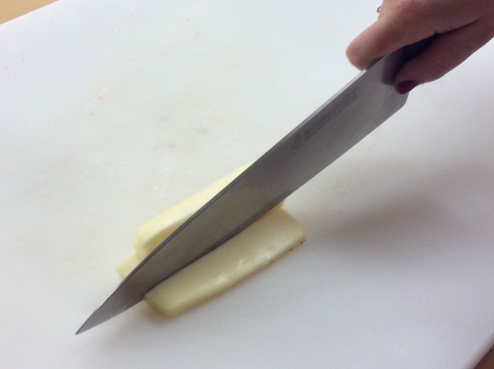 Dice the mozzarella cheese so it is the same size as the tomato.