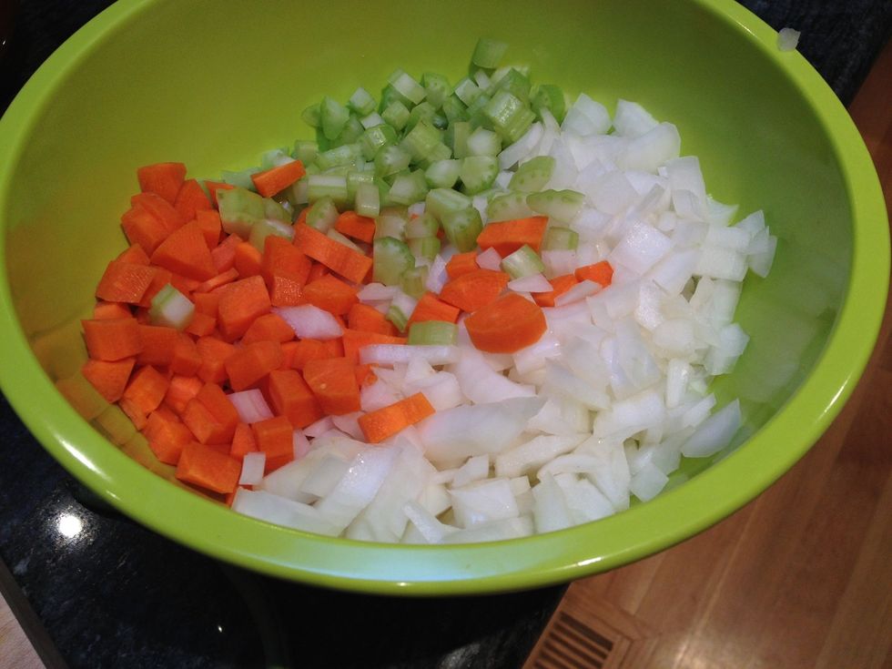 Dice the onion, the carrots and the celery.