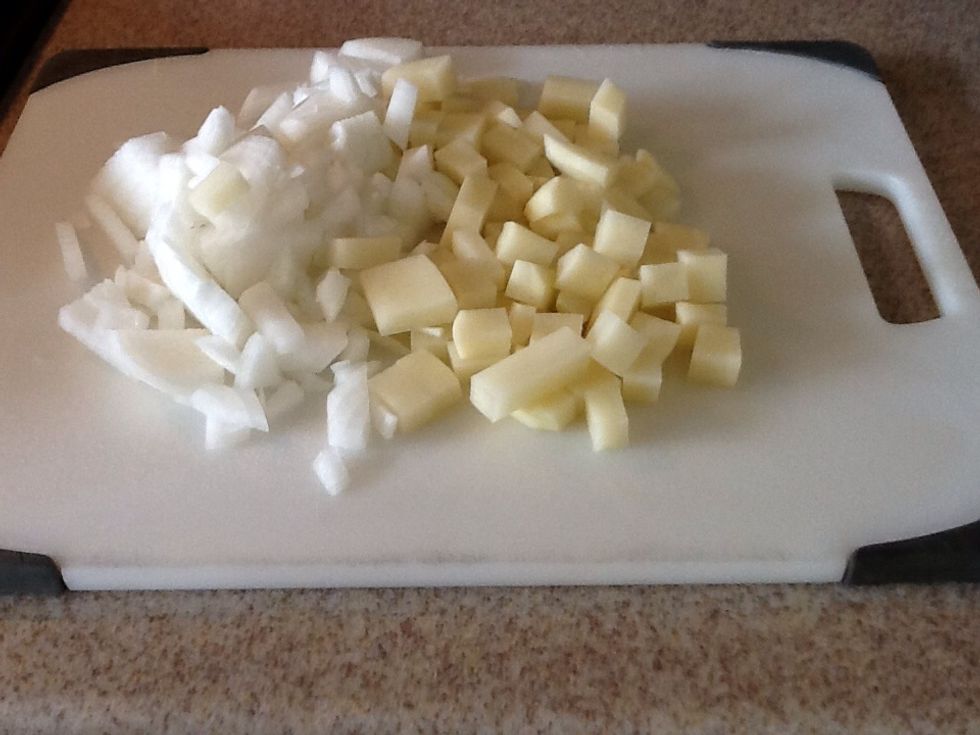 Dice the potato and the onion while you preheat a large frying pan on medium heat.
