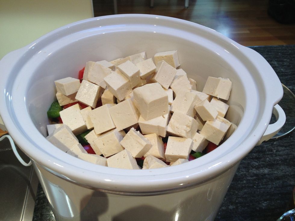 Dice the tofu and the water chestnuts and add to the slow cooker.