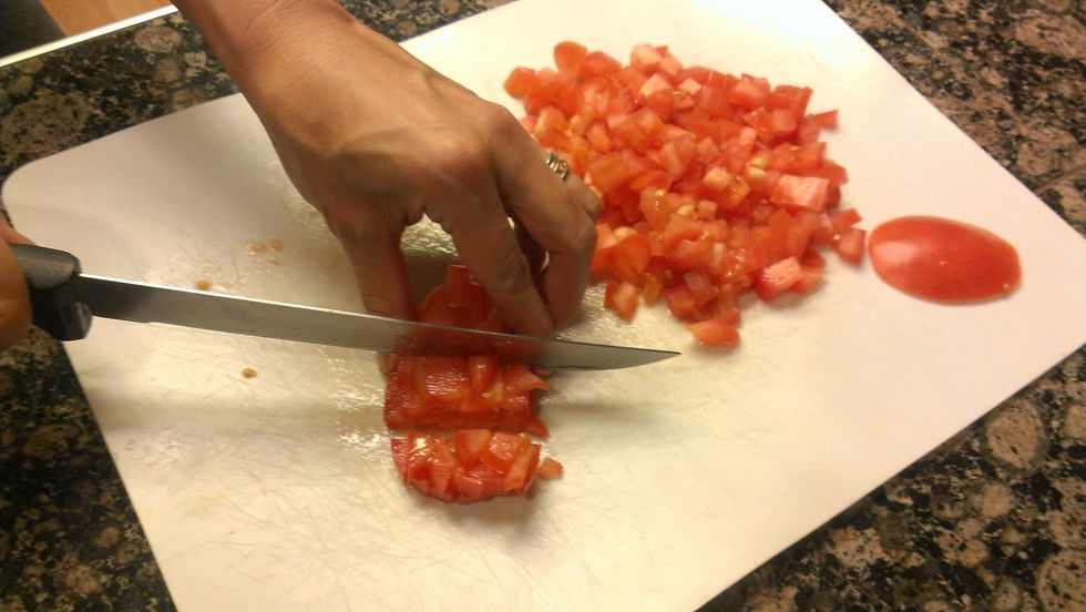 Dice tomatoes.