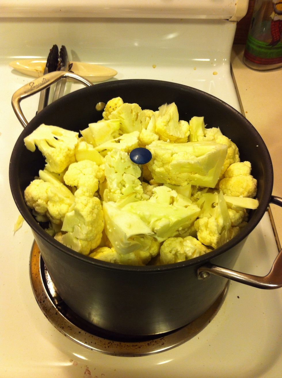 Dice up the cauliflower and add it to a pot with a steam basket, cook 10-15 minutes until fork tender