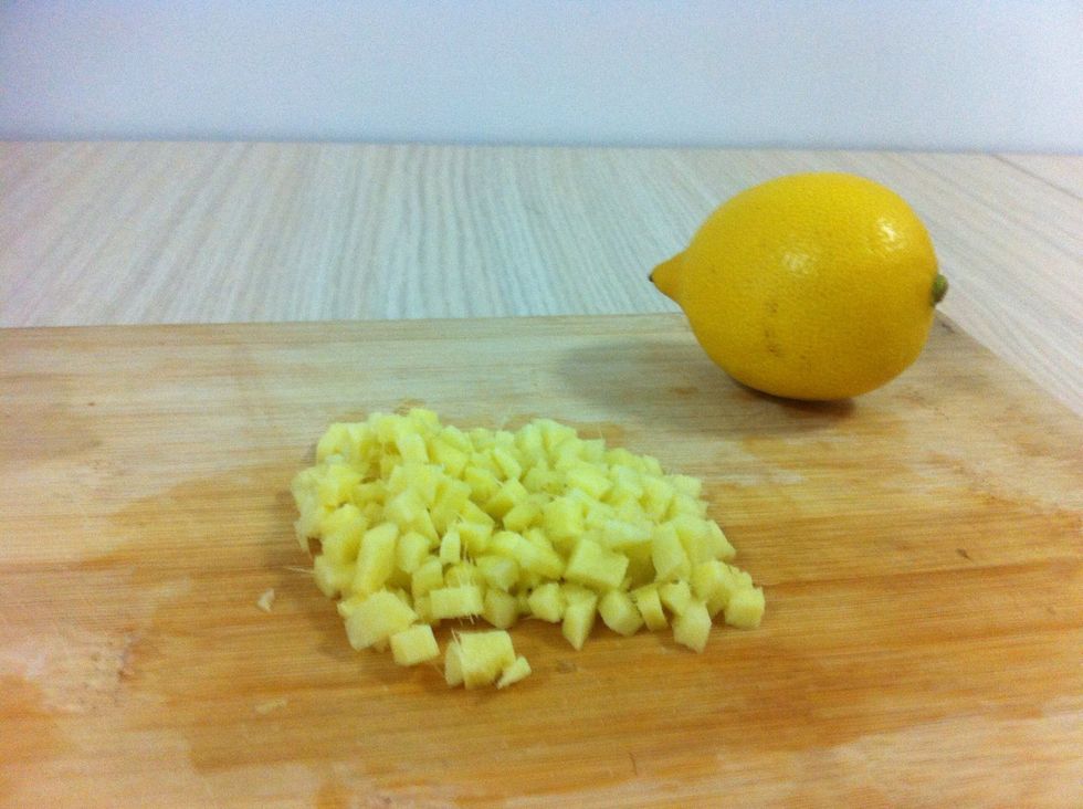 Dice up the peeled section of ginger. Lemon shown for size purposes.