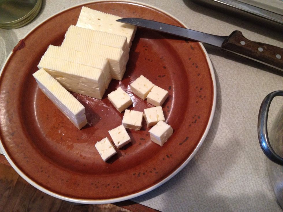 Dice your cheese on a sterilised dish. The feta cheese can be eaten at this point but it develops more taste over the next couple of days.