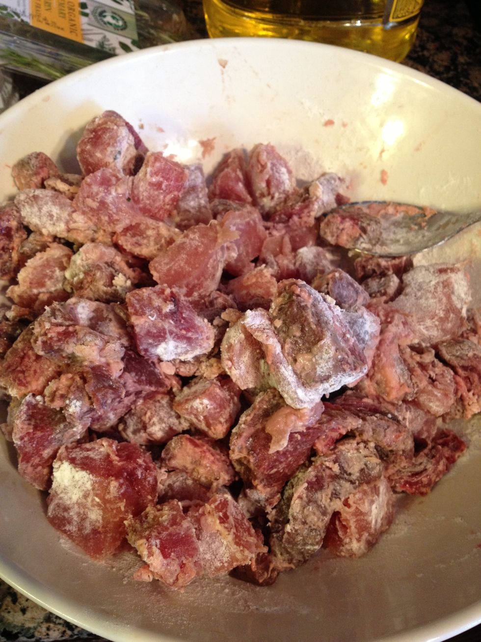 Dice your meat (I'm using elk and deer here, but beef would work just as well) into small chunks and place in a bowl. Sprinkle with 2 tbsp of flour and salt and pepper. Mix until coated.