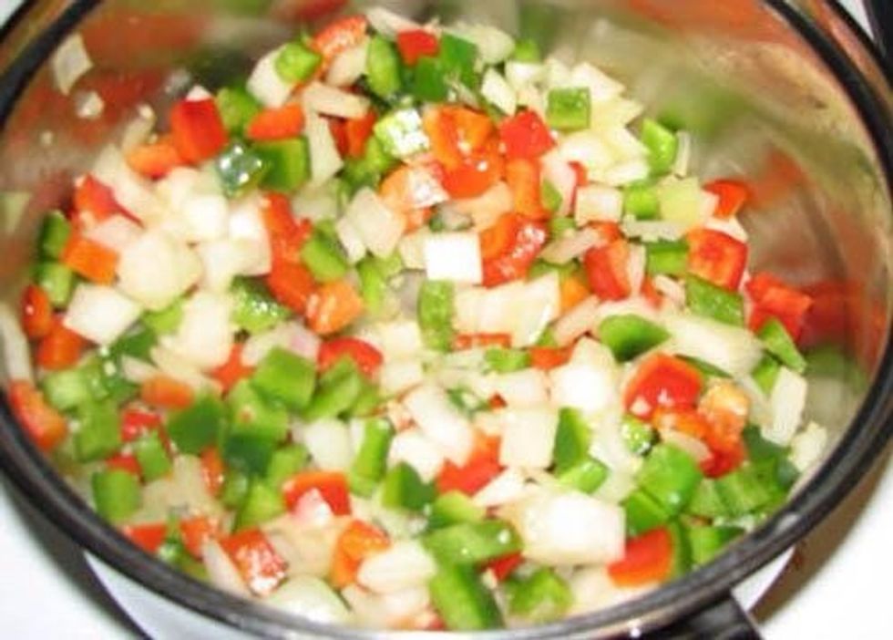 Dice your peppers, onion and garlic, sweat over medium heat.